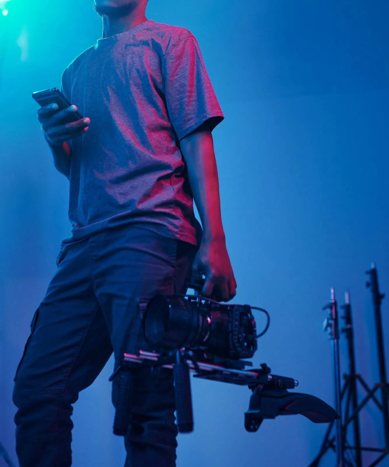 Video operator working with camera in studio